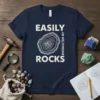 Easily Distracted By Rocks t-shirt design with a graphic of a cross-section of a rock and bold white text
