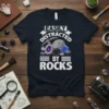 Easily Distracted By Rocks t-shirt design featuring geological specimens like amethyst, obsidian, and lapis lazuli with mining tools