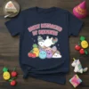 T-shirt with "Easily Distracted By Squishies" text, featuring a unicorn, pineapple, cherries, and kawaii characters