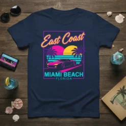 East Coast Miami Beach Florida text with retro sunset, palm trees, and a sports car graphic on a navy t-shirt