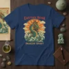 Eastern Roar Dragon Spirit t-shirt with a teal dragon amidst waves and clouds, stylized sunburst background