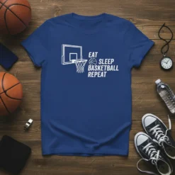 Eat Sleep Basketball Repeat text with basketball hoop graphic on a blue t-shirt