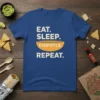 Eat Sleep Chipotle Repeat text design on a blue t-shirt, featuring a graphic bowl and food theme