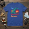 Eat Sleep Concerts Repeat t-shirt with graphics representing food, sleep, music, and a concert crowd