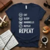 Eat Sleep Handbells Repeat T-Shirt with icons for eating, sleeping, handbells, and repeating. Navy blue tee