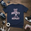 Navy blue t-shirt with "Eat Sleep Hockey Repeat" text and a hockey player graphic
