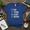 Eat Teach Sleep Repeat T-Shirt with clock, fork and knife, book, and moon graphics, white text on navy blue