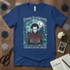 Edward Scissorhands holding a heart of roses, with text "Edward Scissorhands Forever Sculpting Dreams" on a blue t-shirt