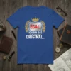 Blue t-shirt with the German text "Egal. Ich bin das Original.." in white and red, surrounded by a laurel wreath
