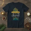 Eid Mubarak 2025 Eid Mubarak 1446 t-shirt with crescent moon, mosque graphic, and Arabic calligraphy in gold and teal