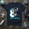Astronaut holding a planet graphic with "Eight Years Old" text on a navy blue t-shirt, perfect for an 8th birthday
