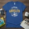 Blue t-shirt with "El Mejor Abuelito Del Mundo" text in yellow and white, featuring a graphic of a smiling grandfather