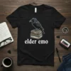 Elder emo text with a crow perched on a stack of books graphic on a black t-shirt
