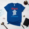 Blue t-shirt with "Elect more women" text and a graphic of women forming an upward arrow