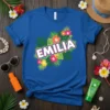 Emilia personalized name t-shirt with tropical hibiscus flowers and green palm leaves, royal blue shirt