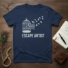 Escape Artist t-shirt design with a white bird cage and birds flying out, text reads ESCAPE ARTIST