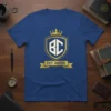 EST. MMXX Roman numeral crest t-shirt design in gold and white on a royal blue shirt