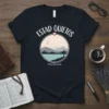 Christian t-shirt with "Estad Quietos Psalm 46:10" text and a serene landscape graphic featuring mountains, lake, cross, and moon