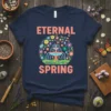 Eternal Spring text with a colorful floral circle framing a fountain graphic on a navy t-shirt