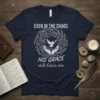 Christian t-shirt with "Even In The Chaos His Grace Still Finds Me" text and dove in hands graphic