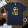 Navy blue t-shirt with yellow "EVENT STAFF" text and megaphone graphic, identifying event crew members