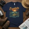 Everglades National Park Florida t-shirt design with a large alligator in the foreground and a sunset over water