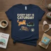 Every Day Is Caturday t-shirt with three cute cartoon cats playing and sleeping