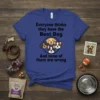 T-shirt with black text "Everyone thinks they have the Best Dog" above a circle of four cartoon dog faces, and