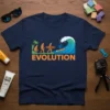 Evolution of Surfing T-Shirt design showing human evolution leading to a surfer riding a wave, with orange text "EVOLUTION" below