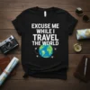 Black t-shirt with white text "Excuse Me While I Travel The World" and a graphic of the Earth with airplanes