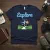 Navy blue t-shirt with the word "Explore" above a compass design, mountain, and landscape