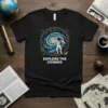 Black t-shirt with "Explore The Cosmos" text and astronaut graphic in a galaxy circle
