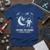 Explore The Cosmos Astronaut's Adventure t-shirt design featuring an astronaut, moon, stars, and constellations