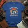 Explore the Summit Adventure Awaits t-shirt design featuring mountains, eagle, and sunset graphic