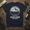 Explore The Wild t-shirt with mountain, moon, and river graphic in a circle, white text below