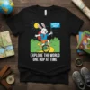T-shirt design with a smiling bunny on a unicycle holding an "Adventure Awaits" flag, text reads "Explore The World One
