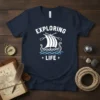 Navy blue t-shirt with white text "Exploring Life" above a graphic of a Viking ship with oars and waves