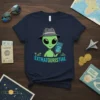 Extratouristial t-shirt design with a cartoon alien wearing a fedora and holding a smartphone displaying a globe, with small icons