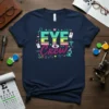 Eye Crew t-shirt design with colorful typography and ophthalmology graphics like an eye, microscope, and caduceus symbol