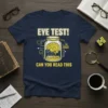 Navy t-shirt with "EYE TEST! CAN YOU READ THIS" text and a graphic of a brain in a jar, symbolizing