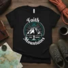 Faith Can Move Mountains quote on black t-shirt with mountain graphic and inspirational design