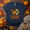 Navy t-shirt with geometric pumpkin graphic and "Fall Harvest Blessings" text, perfect for autumn lovers