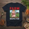 Farm Inspector T-Shirt with a cute pig wearing a hard hat and holding a magnifying glass, inspecting a farm field