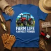 Farm Life Harvest Power text with a red tractor graphic on a blue t-shirt, depicting a rural farming scene