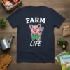 FARM LIFE text above a cartoon pig wearing green overalls and holding a pitchfork on a navy t-shirt