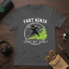 Fart Ninja Silent But Deadly t-shirt design with a cartoon ninja in green smoke