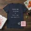 Navy t-shirt with white text "Feed Me Pizza & Tell Me Im Pretty" and a small pizza graphic