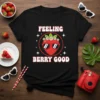 Feeling Berry Good strawberry t-shirt with sunglasses and flowers design, black tee, white text, red strawberry graphic