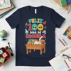 Feliz 100 Días De Escuela t-shirt design with playful graphics of sunglasses-wearing numbers and school desk