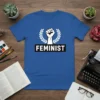 Feminist fist symbol with laurel wreath and "Feminist" text on a royal blue t-shirt